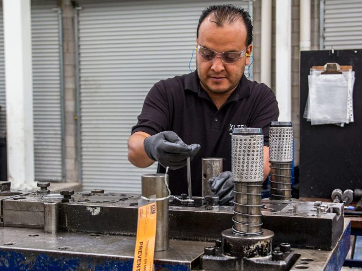 Staff maintaining tooling