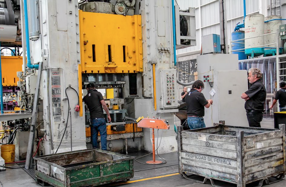 Crew working stamping press